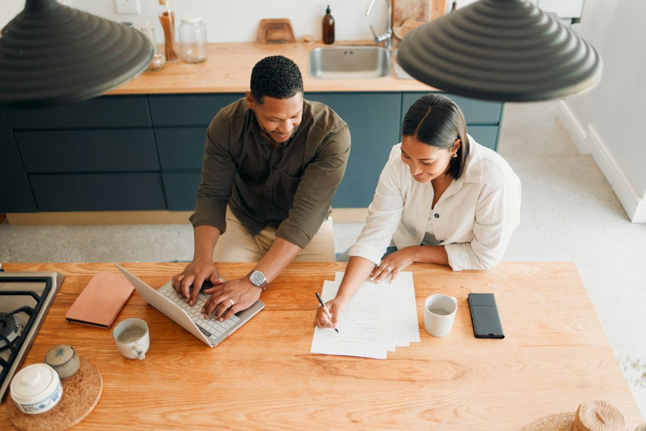 couple-calculating-budget-finance-and-tax-while-planning-investment-loan-and-bills-at-home-from